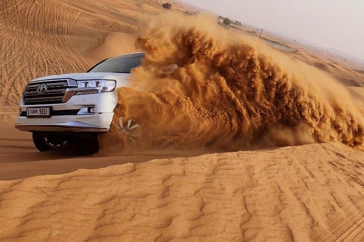 Morning Desert Adventure Dubai — Camel Ride, Dune Bashing & Sandboarding in Lahbab photo 4