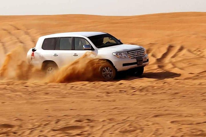 Dubai Desert Safari: Sunset Dune Bashing, Camel Ride & BBQ Experience