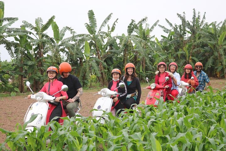 Red River Delta Vespa Tour with Female Ao Dai Riders Half-Day photo 1