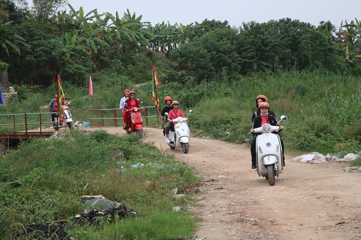 Red River Delta Vespa Tour with Female Ao Dai Riders Half-Day photo 3