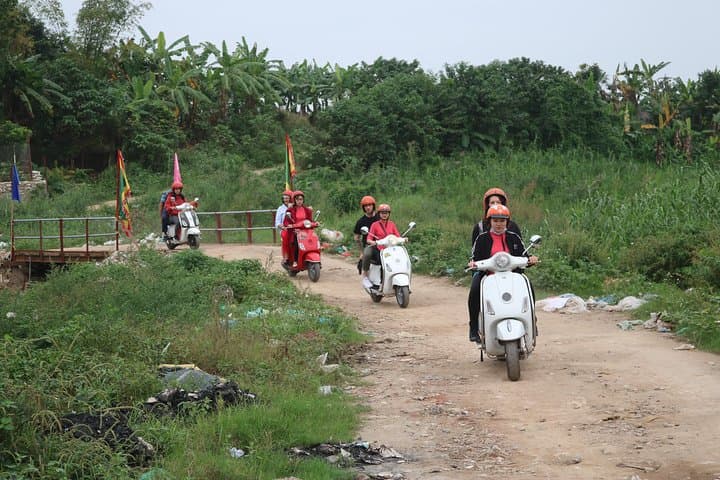 Red River Delta Vespa Tour with Female Ao Dai Riders Half-Day photo 4