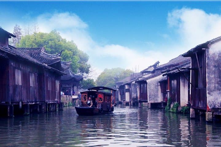 Wuzhen Water Town Day Tour from Hangzhou — Canals, Ming Houses & Boat Ride