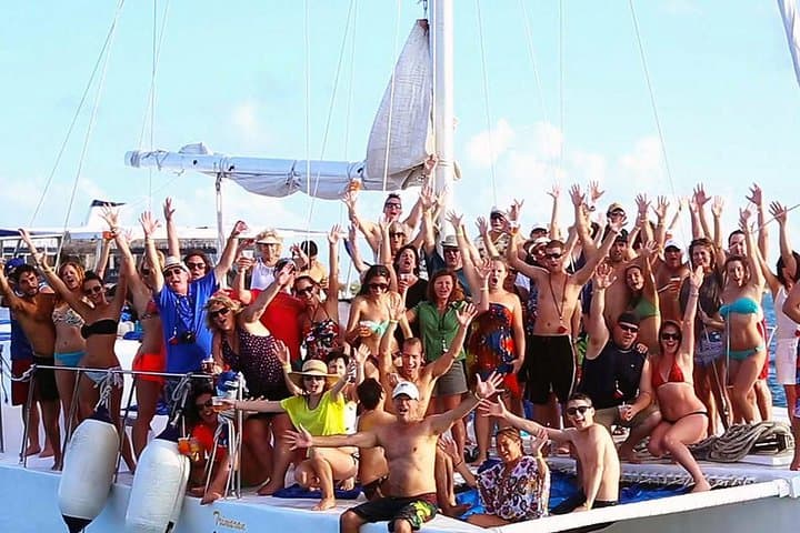Sunset Party Catamaran to Isla Mujeres — Snorkel, Beach Club & Open Bar photo 1