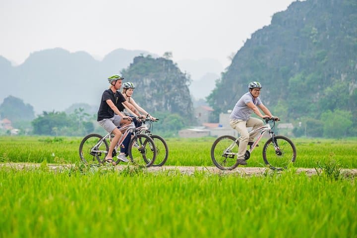 Tam Coc, Mua Cave & Hoa Lu Day Tour from Hanoi — Boat, Mua Viewpoint & Cycling photo 6