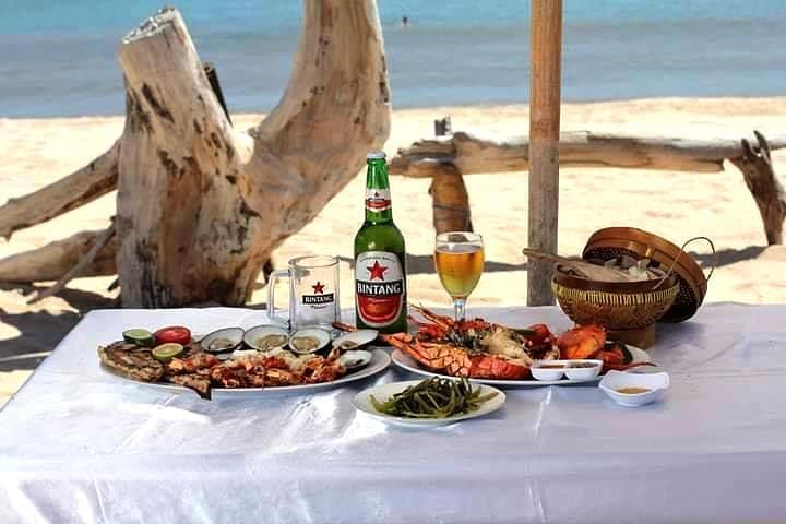 Bali Sunset at Uluwatu: Kecak Dance, Cliffside Views & Jimbaran Seafood photo 3