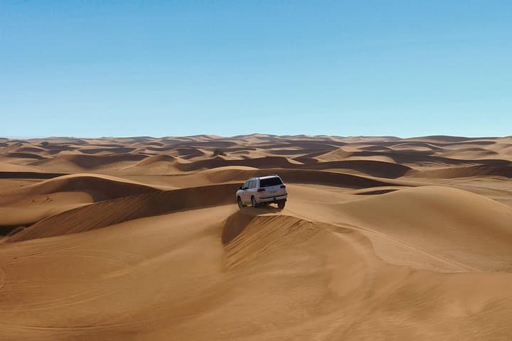 Private Sunrise Desert Safari in Dubai: Dune Driving, Camel Rides & Sandboarding photo 4