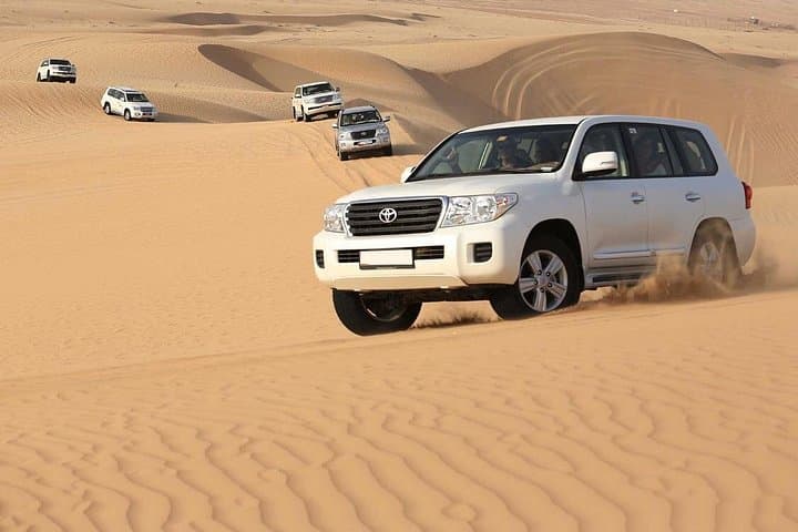 Morning Red Dunes Safari Dubai: Camel Trek, Dune Bashing & Sandboarding photo 3