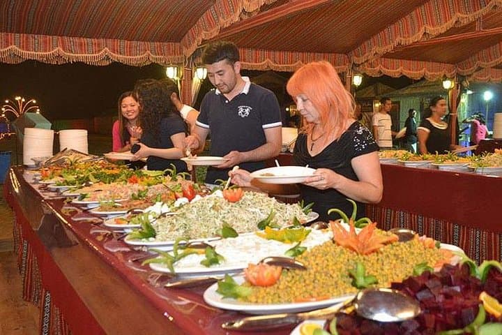Dubai Desert Safari: Dune Bashing, Camel Ride & BBQ Dinner Experience photo 2