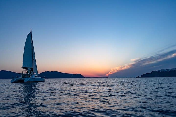 Santorini Sunset Cruise: BBQ, Hot Springs & Red Beach Swim