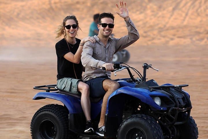 Red Dunes Quad Bike Desert Safari with VIP Camp, Camels & Sandboarding photo 1