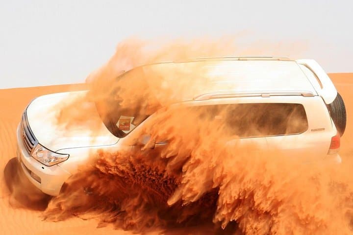 Morning Dubai Desert Safari: Dune Bashing, Sandboarding & Camel Ride photo 1
