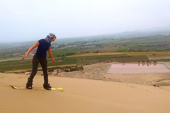 Thrill of Sandboarding in Northern Peru: Glide Down Dunes with Panoramic Coastal Views