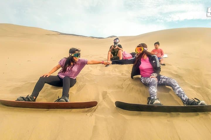 Thrill of Sandboarding in Northern Peru: Glide Down Dunes with Panoramic Coastal Views photo 3