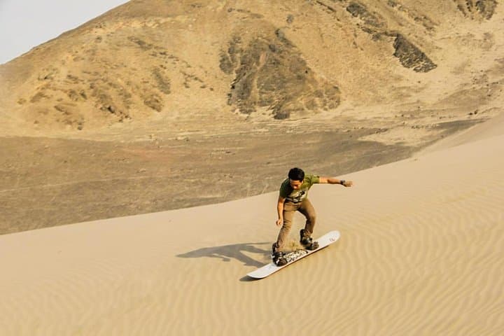 Thrill of Sandboarding in Northern Peru: Glide Down Dunes with Panoramic Coastal Views photo 4
