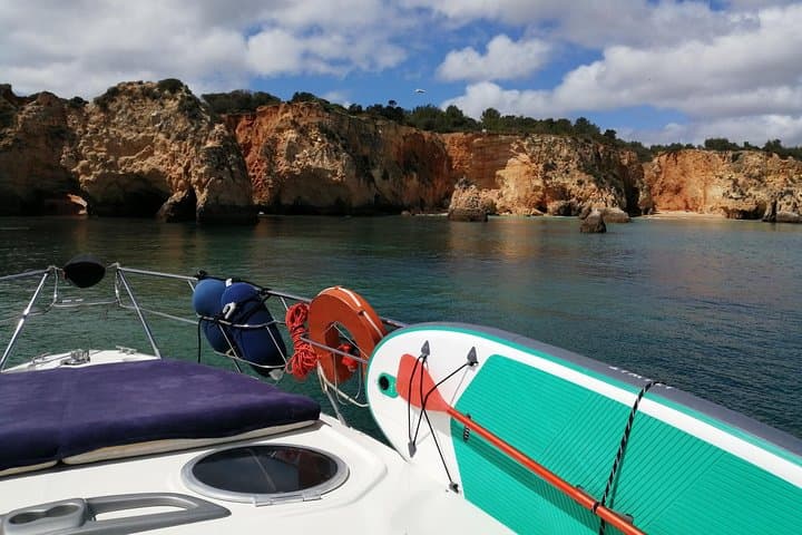 Full-Day Private Yacht Charter from Lagos: Tapas, Paddleboarding & Coastal Caves photo 3