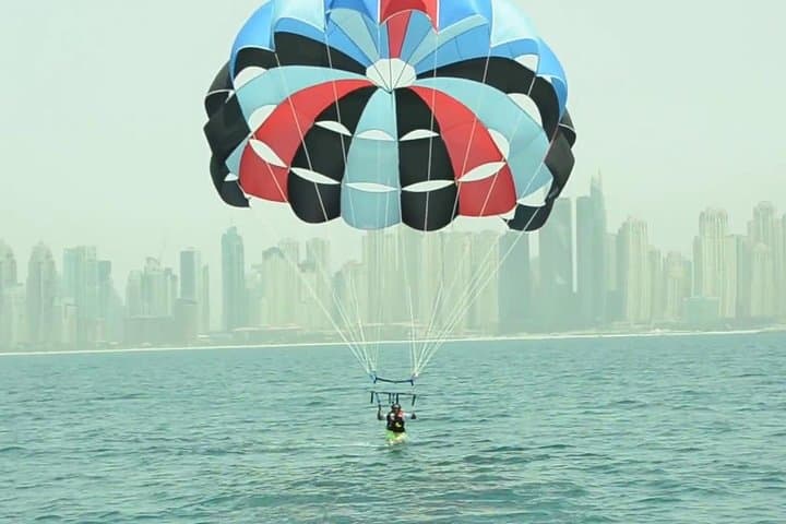Soar Above Dubai Marina: Parasailing with Private Transfers