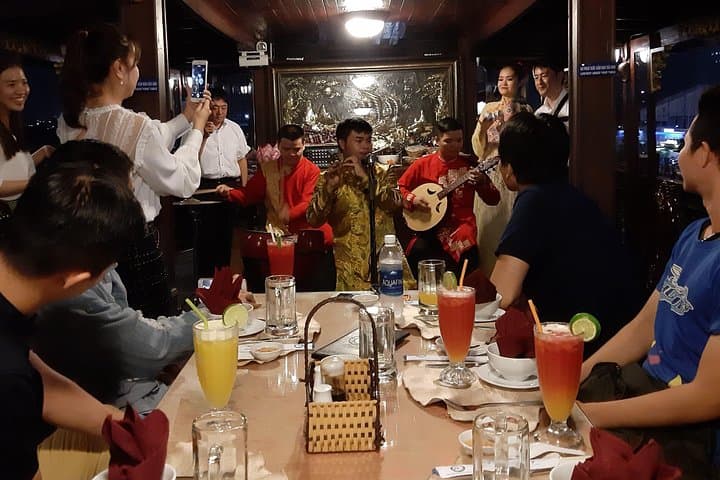 Saigon by Night: Bitexco Views, River Dinner & Motorbike Alley Tour