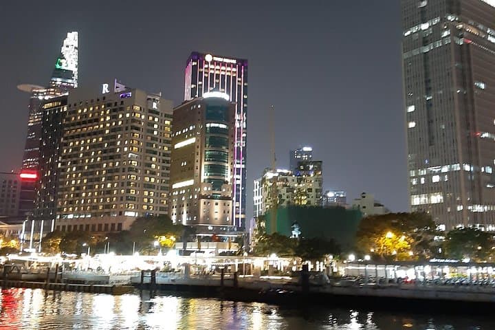 Saigon by Night: Bitexco Views, River Dinner & Motorbike Alley Tour photo 4