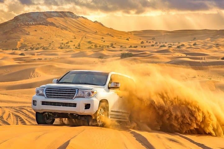 Exclusive Desert Safari Dubai: Dune Bashing, Bedouin Camp & Sunset Show