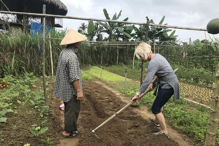 Hoi An Organic Farm Experience: Rural Cycling, Basket Boat & Cooking Class photo 2
