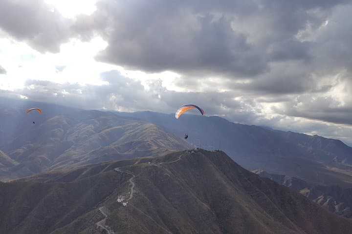 Tandem Paragliding Over Mendoza's Pre-Range: Cerro Arco Flight Experience photo 3