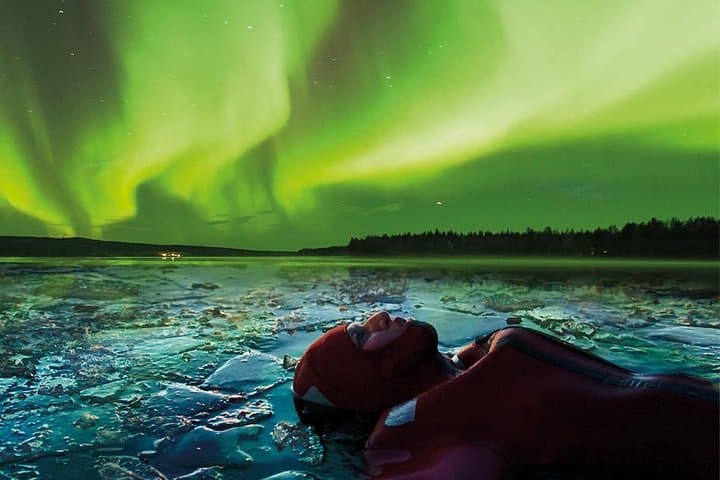 Aurora Ice Floating in Rovaniemi: Dry-Suit Northern Lights Float on a Frozen Lake