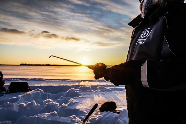 Ice Fishing Near Rovaniemi: Private Frozen-Lake Experience with Campfire and Photos photo 5
