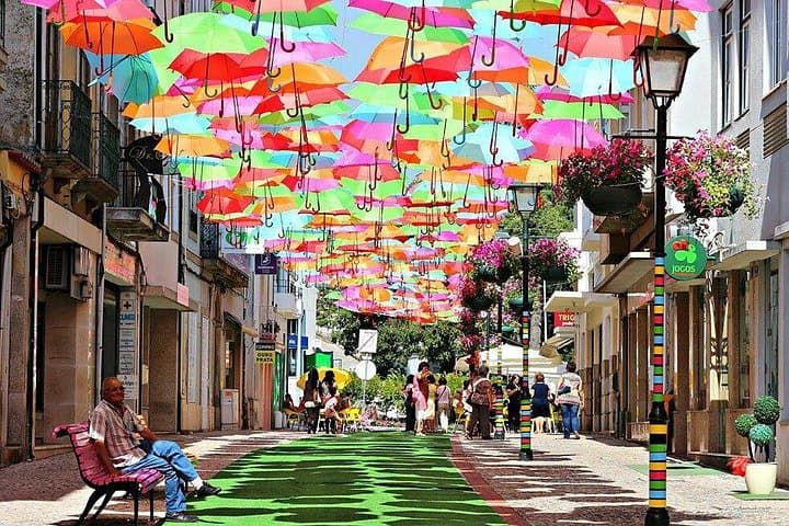 Private Coastal Journey from Lisbon: Óbidos, Nazaré & Águeda Umbrella Sky photo 3