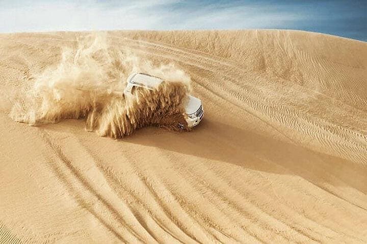 Morning Desert Safari with Camel Trekking in Dubai — Dune Bashing & Sandboarding photo 1