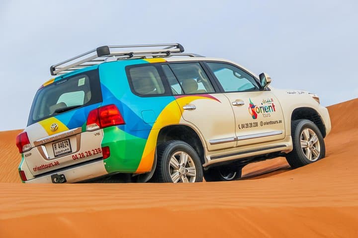 Morning Dubai Desert Safari: Dune Bashing, Camel Ride & Sandboarding