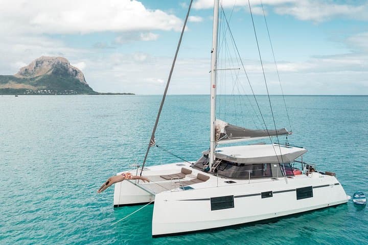 Full-Day Private Catamaran Cruise West Coast Mauritius: Dolphins, Snorkeling & Crystal Rock photo 1