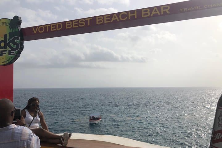 Negril Blue Hole & Rick's Café Combo: Cliff Jumps, Mineral Springs, and Local Shopping photo 2