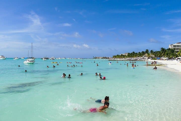 Sail to Isla Mujeres: Full-Day Catamaran Snorkel & Beach Club Experience photo 1