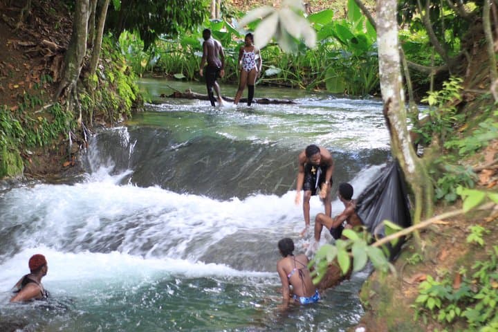 Benta River Falls & Rick's Cafe Day Tour from Grand Palladium — Waterfalls, Mud Baths & Cliff-Jumping in Negril photo 2