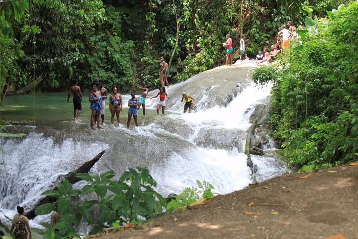 Benta River Falls & Rick's Cafe Day Tour from Grand Palladium — Waterfalls, Mud Baths & Cliff-Jumping in Negril photo 4