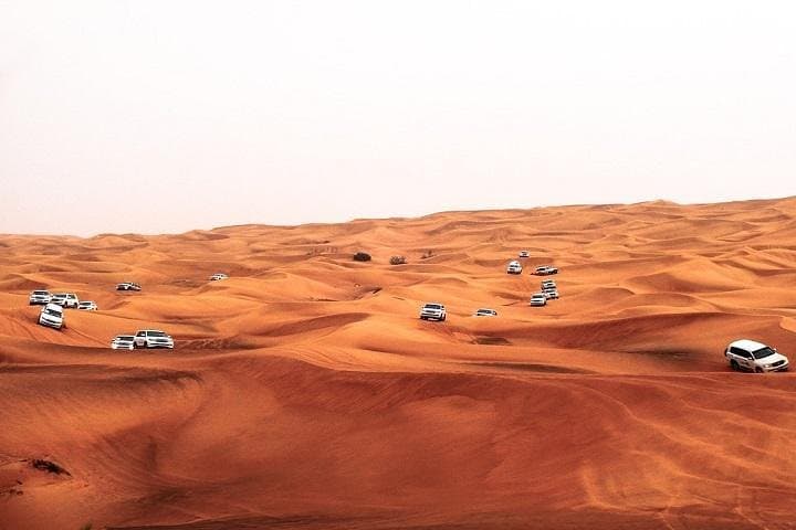 Red-Dune Dubai Desert Safari: Dune Bashing, Sandboarding & Bedouin BBQ