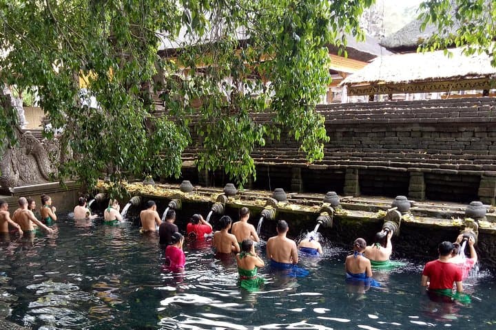 Cycling to Tirta Empul: Holy Water Blessing Bike Tour from Ubud