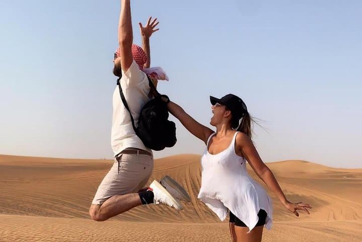 Dubai Evening Desert Safari: Dune Bashing, Camel Rides & BBQ Sunset Experience photo 4