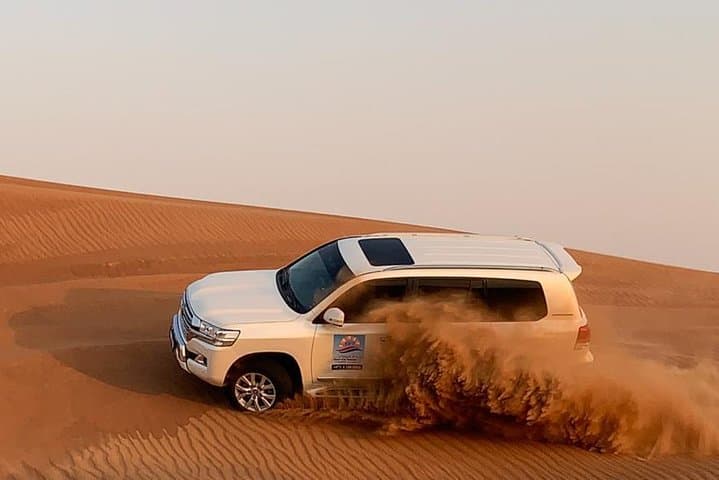 Morning Dubai Desert Safari: Camel Ride, Sandboarding & Dune Bashing at Sunrise photo 4