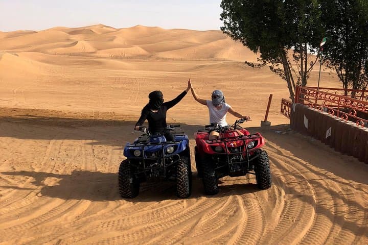 Sunset Quad Bike Safari on Dubai's Red Dunes — Sandboarding, Camels & Desert Camp