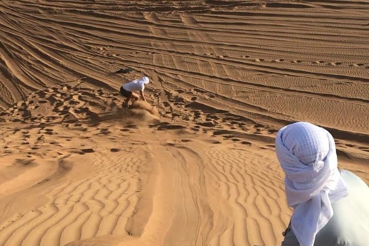 Sunset Quad Bike Safari on Dubai's Red Dunes — Sandboarding, Camels & Desert Camp photo 2
