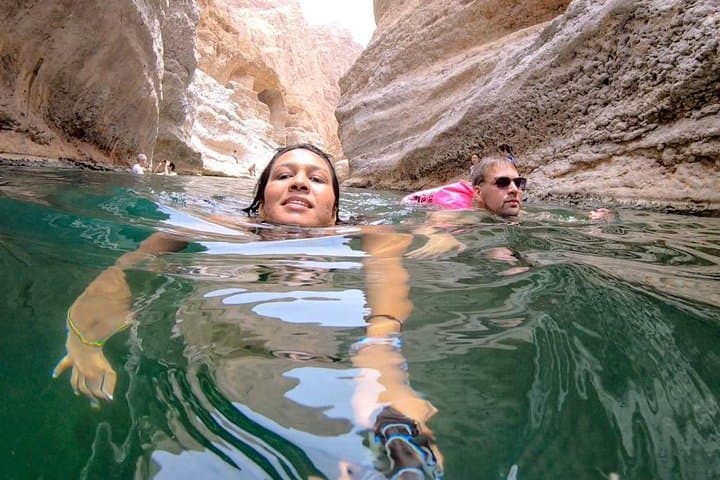 Swim Through Stone: Full-Day Wadi Shab Trek and Coastal Caves from Muscat