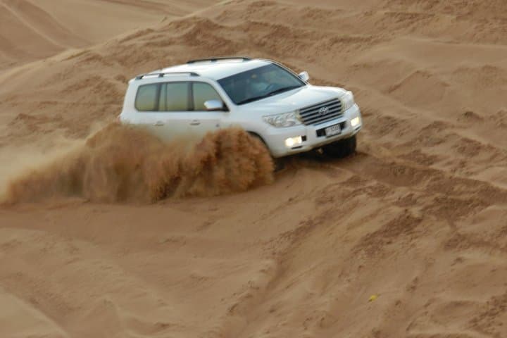 Morning Red Dunes Desert Safari with Camel Ride & Sandboarding — Dubai Adventure photo 3