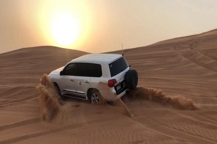 Sunset Red Dunes 4x4 Camel Safari with BBQ Dinner in Dubai
