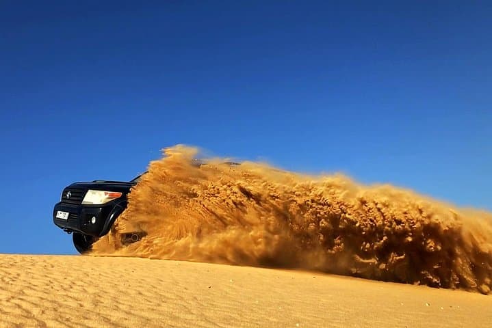 Evening Desert Safari Dubai: Dune Drive, Bedouin Camp & Live Shows