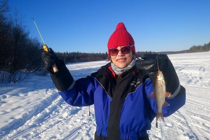 Ice Fishing at Pyhä‑Luosto: Guided Car Pickup, Hot Drinks & Beginner-Friendly Holes