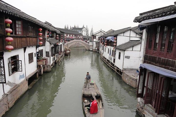 Suzhou Private Day Tour: Zhouzhuang Water Town & Panmen Garden Guide photo 2