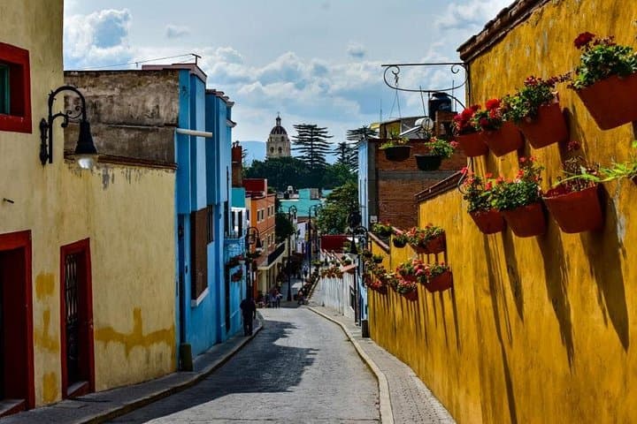 Atlixco de Las Flores & Val'Quirico Day Tour — Flower Markets, Colonial Streets, and Tuscan-Style Plaza