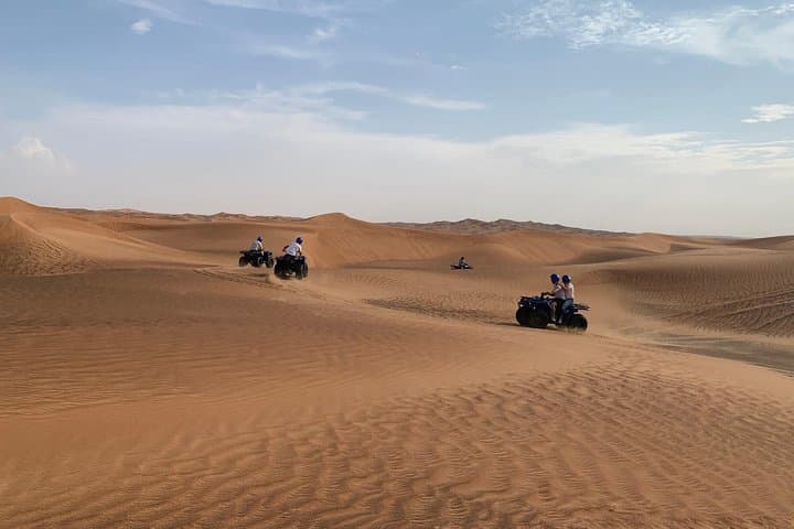 Sunset Quad Bike Safari on Dubai's Red Dunes — Sandboarding, Camels & Desert Camp photo 4
