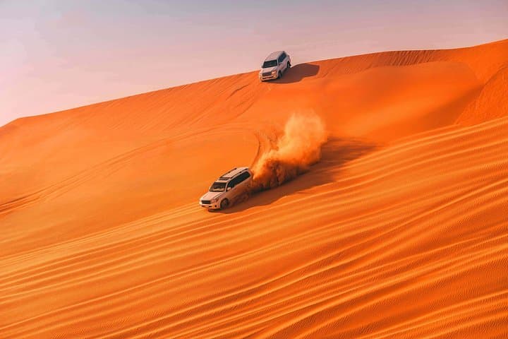 Evening Dubai Desert Safari: Dune Bashing, Camel Rides & BBQ Under Stars